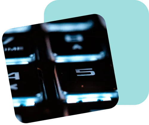 Close-up of an illuminated computer keyboard number pad with the number 5 in focus, symbolizing digital connectivity and secure data entry